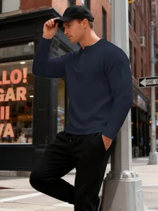 Men's waffle knit Henley shirt in navy blue, detailed texture in an urban setting