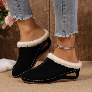 Cozy women's black wedge slippers with white fleece lining and stylish side cutout