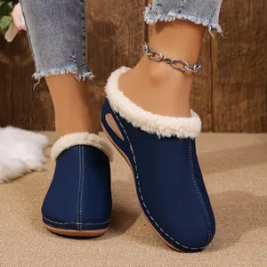 Navy blue wedge mules for women featuring plush fleece lining and decorative stitching
