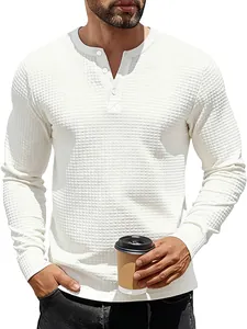 Macro view of white long-sleeve men's Henley shirt featuring jacquard waffle texture