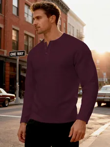 Detailed texture view of dark burgundy waffle knit Henley shirt for men on street