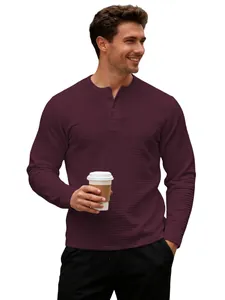 Close-up detail of the burgundy men's waffle knit Henley shirt worn by a model