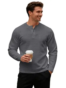 Close-up of men's dark gray waffle-knit Henley shirt showing textured checkered fabric
