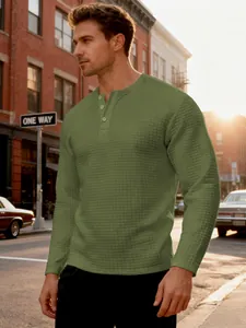 Olive green waffle knit Henley shirt for men featuring a slim fit and classic button neck.