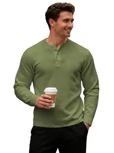 Men's olive green long sleeve waffle knit Henley shirt with a classic button neckline