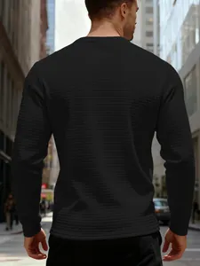 Back view of men's black waffle knit sweatshirt with textured jacquard grid detail.