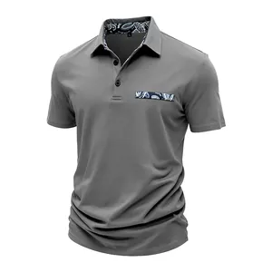 Detailed view of gray slim fit Polo shirt with paisley collar and pocket accents.