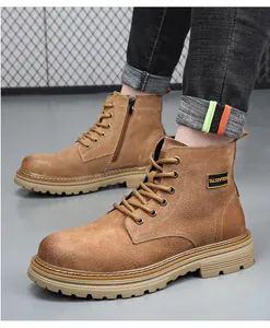 Detail of brown suede men's lace-up Martin boots with a functional side zipper.
