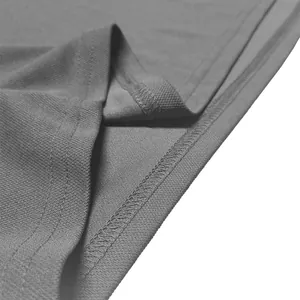 Close-up detail view of the hemline and fine stitching on a grey quick-dry polo shirt