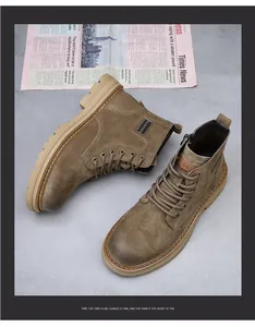 Detail view of men's leather Martin boots with vintage brown suede and lace-up design