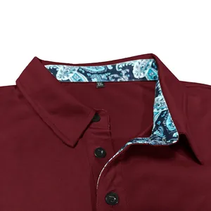 Close-up of maroon men's polo shirt featuring paisley collar lining and quick-dry mesh fabric