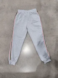 Back view of men's heavy gray fleece sweatpants featuring athletic side stripes