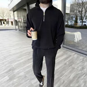 Men's minimalist black half-zip corduroy sweatshirt and pants set casual lifestyle look