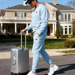 Men's light blue jacquard knit tracksuit set featuring textured sweatshirt and joggers