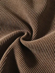 Macro view showing the soft brown ribbed corduroy fabric texture of the men's sweatshirt