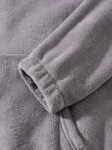 Close-up of soft grey polar fleece fabric texture on a casual zip-up hoodie jacket.