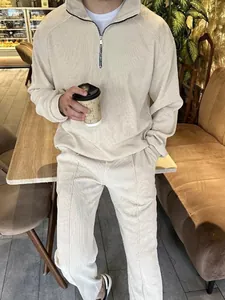 Men's minimalist cream half-zip sweatshirt and textured long pants leisure set