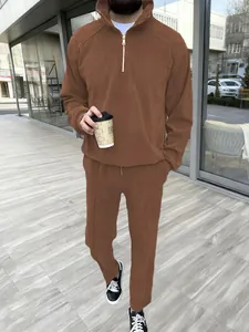 Men's stylish brown two-piece casual set featuring a half-zip sweatshirt and matching pants