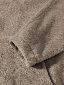 Close-up of soft brown polar fleece sleeve cuff with high quality stitching detail