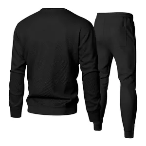 Detailed back view of men's black textured jacquard knit tracksuit with joggers