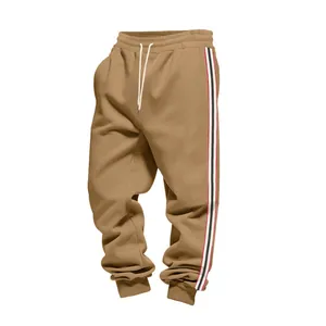 Detailed macro view of men's heavyweight fleece joggers featuring vintage side stripe patterns