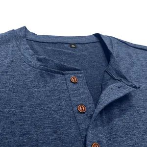 Detailed view of a men's breathable blue Henley shirt neckline featuring wood-tone buttons.