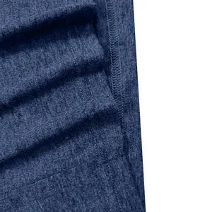 Macro view of blue heathered fabric and double-needle stitching on a men's Henley shirt