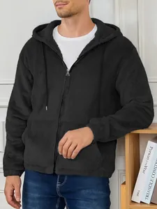 Detail view of men's black fuzzy fleece zip-up hooded jacket with soft texture
