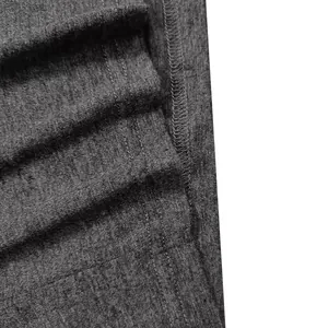 Detailed macro shot of grey heather fabric and durable stitching for men's Henley t-shirt