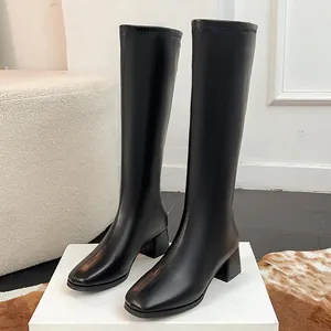 Detailed side view of black square-toe knee-high knight boots with a stable block heel.