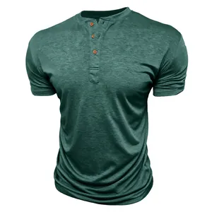 Detailed view of men's dark green short-sleeved Henley shirt with three wooden buttons