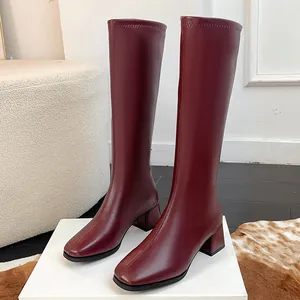 Elegant burgundy square toe knee-high boots with chunky mid-heel and minimalist design