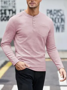 Close-up detail of men's dusty pink waffle knit long sleeve Henley shirt with buttons