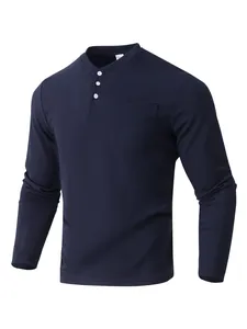 Close-up of navy blue men's waffle knit Henley shirt with buttons and chest pocket