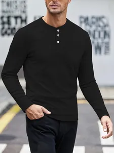 Men's black long-sleeved Henley shirt with button placket and waffle texture detail