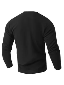 Detailed back view of a black long sleeve waffle knit Henley shirt for casual men's wear