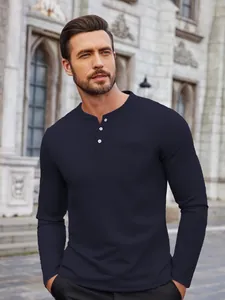 Detailed view of navy blue waffle knit long-sleeve Henley shirt with buttons for men
