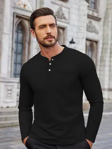 Close-up of a men's black long-sleeve casual Henley shirt with buttons and a front pocket