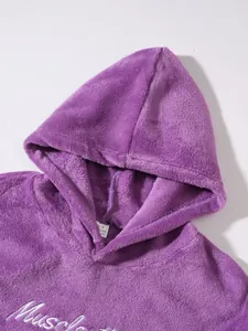 Close-up of soft purple fleece hoodie with white cursive letter embroidery detail