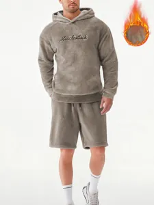 Detailed view of men's grey plush fleece hoodie and shorts set with chest embroidery