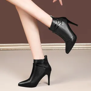 Elegant black pointed-toe stiletto ankle boots with textured finish and back zipper