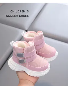 Close-up of pink fur-lined waterproof winter snow boots for toddlers with velcro straps