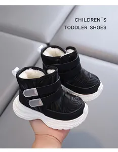 Detailed view of warm black toddler snow boots featuring soft white plush lining texture