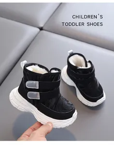 Close-up of toddler snow boot showing warm plush lining and non-slip sole detail.