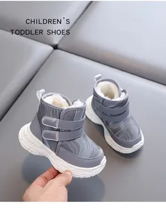 Close-up of gray warm winter toddler boots featuring cozy white faux fur lining