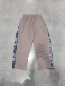 Back view of men's hip-hop straight trousers with paisley side panels and buttons