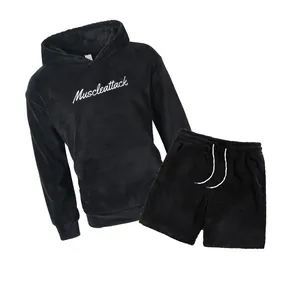 Detailed view of black fleece hoodie and shorts set with Muscleattack embroidery