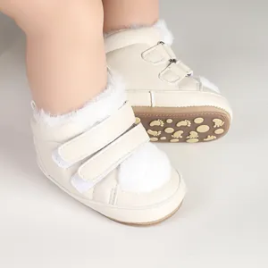 Close-up of warm fleece-lined baby winter boots with Velcro straps and furry trim
