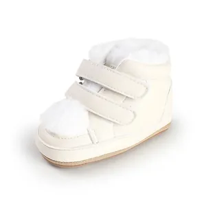 Detailed view of cream baby winter boots with soft white faux fur lining and straps