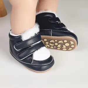 Navy blue baby winter boots with white faux fur lining and non-slip rubber soles